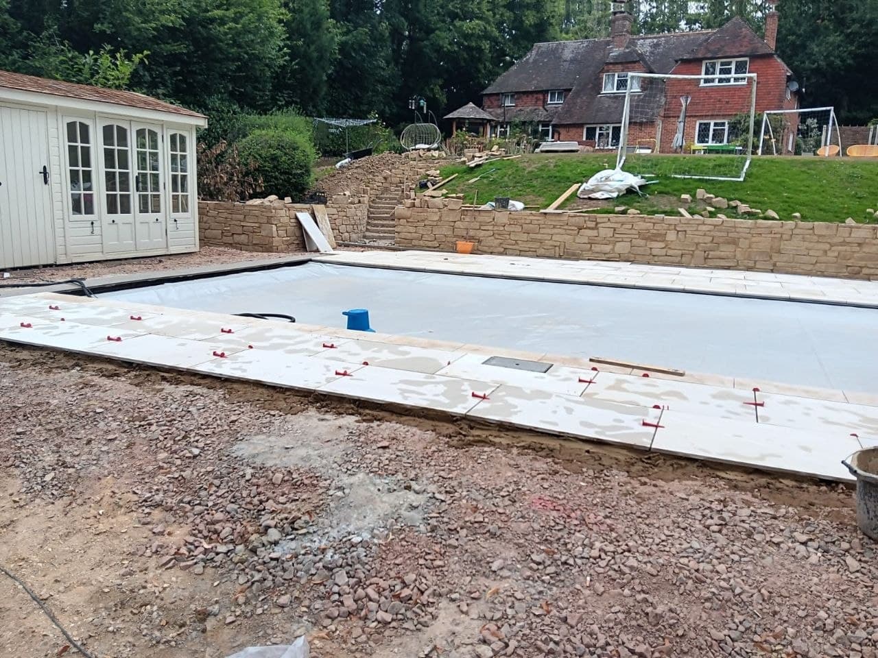Close detail of freshly laid sandstone steps with coursed stone cheek walls