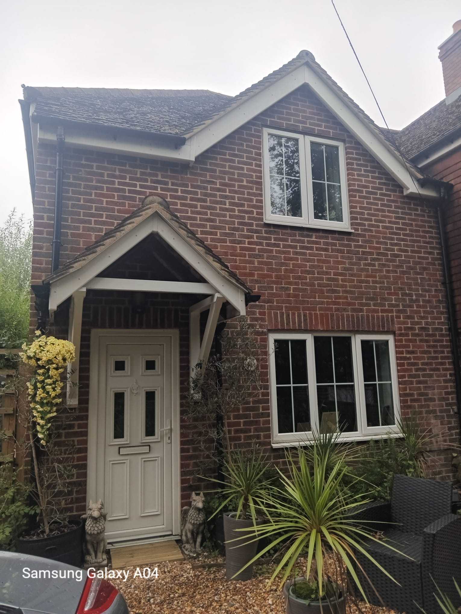 Traditional brick cottage with a tiled porch and fresh brickwork